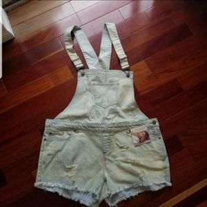 Kittenish distressed overalls